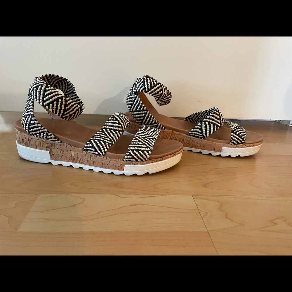 Free with purchase.  Black and white sandals.
